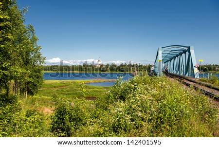 HAPARANDA, SWEDEN - JULY 11: The railway bridge across Torne River on July 11, 2009 in Haparanda. The bridge from Sweden to Finland is unique as it carries dual track gauges - 1520 mm and 1435 mm.