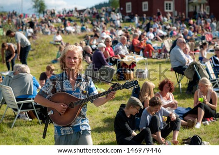 BINGSJO, SWEDEN Ã¢Â?Â? JULY 3: The traditional folk music festival on July 3, 2013 in Bingsjo. The festival is held annually on the first Wednesday in July and attracts thousands of musicians and visitors.