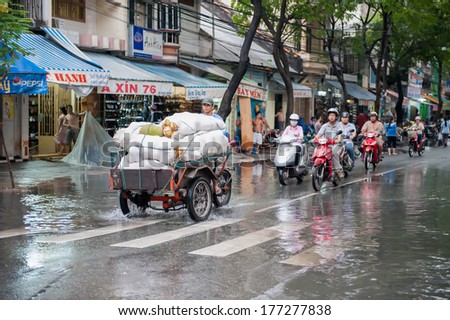 HO CHI MINH CITY, VIETNAM - MARCH 7: Heavy rain and traffic on March 7, 2009 in Ho Chi Minh City. Former Saigon has a population of 8 million and almost 4 million motorbikes.