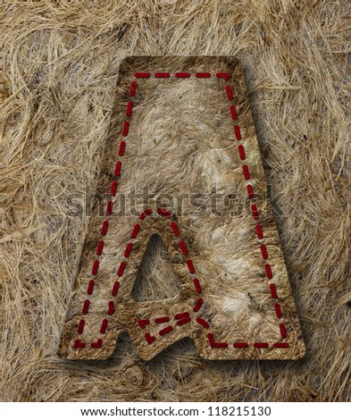 Mulberry Paper Alphabet (A) on brown paper background.