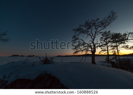 Winter, stony coast of the frozen lake.  winter landscape. Night landscape