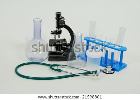 Test tubes and beakers for laboratory experiments, with small Microscope used in scientific research and Medical stethoscope used to listen to heart beats