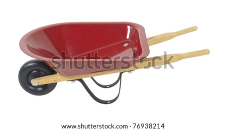 Red wheelbarrow used to transport items while working outdoors - path included