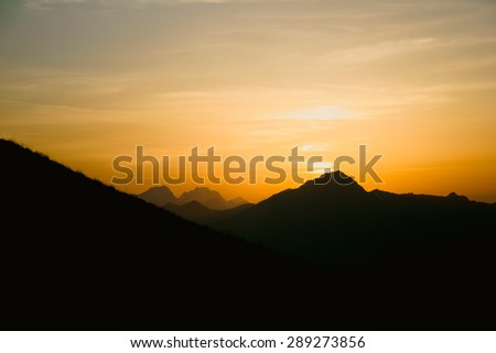 Sunset Landscape with mountains silhouette. Beautiful nature Travel concept