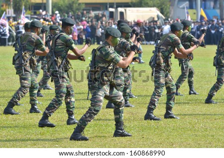 KUANTAN, MALAYSIA - AUG 31: Malaysia Army demonstrate a hand combat defending at National Day parade, celebrating the 55th anniversary of independence on August 31, 2012 in Kuantan, Pahang, Malaysia.