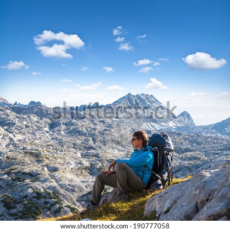 sport woman on the slope of mountain looking ahead