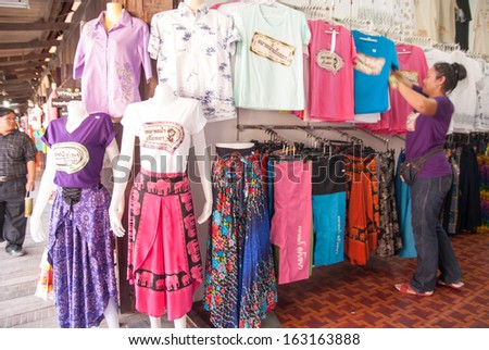 AYUTTHAYA, THAILAND - NOV 2, 2013: The Ayothaya Floating Market. Has a many visitors, both Thais and foreign visitors with varieties of Thai clothes and Thai food.