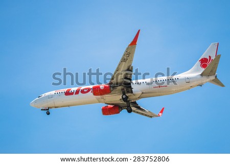 BANGKOK, THAILAND - JUNE 1, 2015: HS-LTI Thai Lion Air Boeing 737-900 landing to Don Mueang International Airport Thailand. Thai Lion Air company is the largest low cost airlines in Asia.