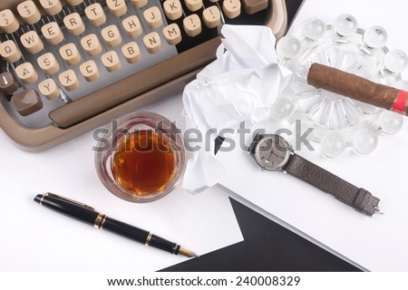 Old german type writer with paper, cigare, vintage watch, fountain pen and glass of whiskey