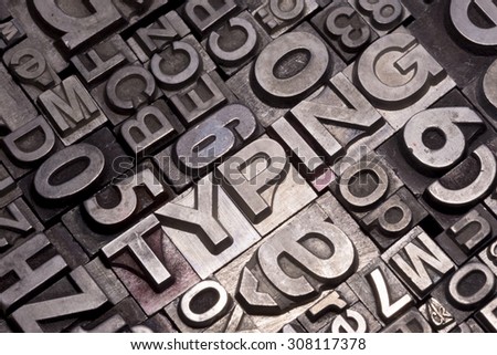 lead type letters form the word Typing