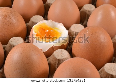 Egg tray with an egg which is eaten.