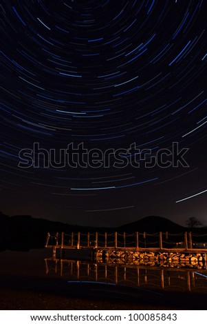Ullswater Star Trail.  Star trails above an Ullswater pier, a lake in the English Lake District.