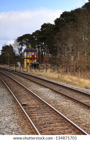 Traditional English Railway Signal Box.  A traditional railway signal box viewed from Armathwaite station on the historic Settle to Carlisle railway in northern England.