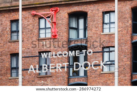 The Albert Dock.  The sign welcoming people to the Albert Dock in Liverpool, Merseyside.  The Albert Dock is a grade 1 listed building and a UNESCO world heritage site.