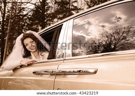 Happy bride in rich car