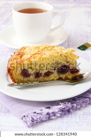 Slice of Cherry Almond coffee cake and cup of tea