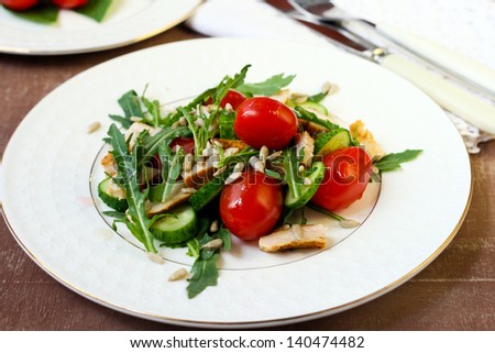 Cherry tomatoes, rocket, chicken, cucumber and seed salad