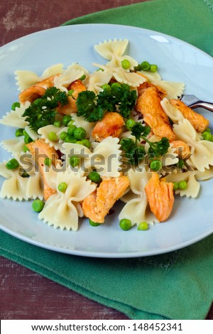 Salmon and pea pasta on plate
