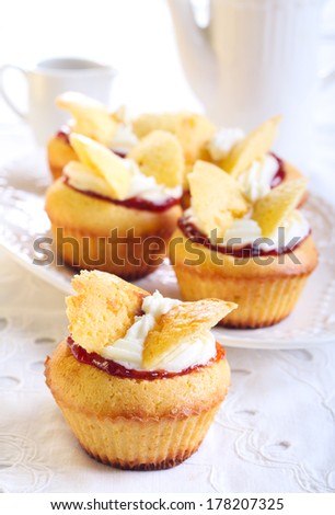 Butterfly cakes with jam and cream