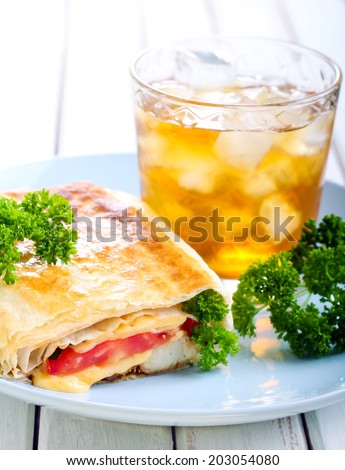 Wrap sanwich with chicken, cheese and tomato filling