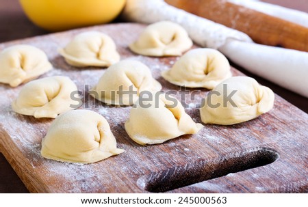 Raw pastry dumplings with meat filling called pelmeni