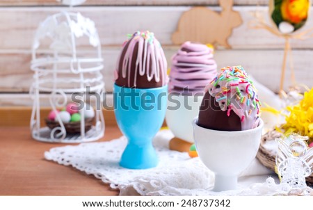 Homemade easter chocolate eggs with glaze and sprinkles