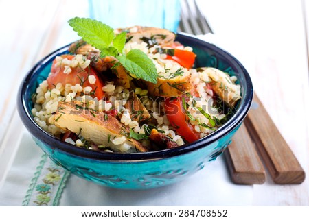 Warm chicken tabbouleh salad in a bowl