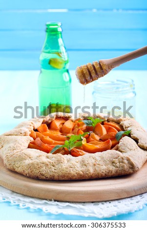 Honey drizzle over apricot pie on wholewheat and corneal pastry crust