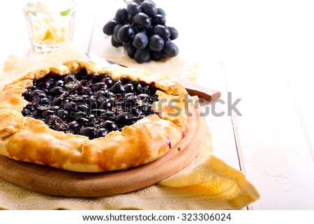 Black grapes and rosemary tart, selective focus