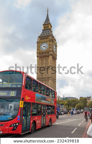 LONDON - OCTOBER 17: London Buses with Big Ben on October 17, 2014 in London. London Bus service is one of the largest urban bus networks in the world with 8,000 buses covering 700 routes.