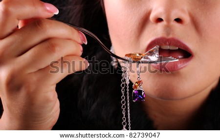 Fork with jewellery near nice lips