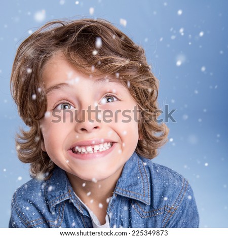 Child looking snow falling with happy face