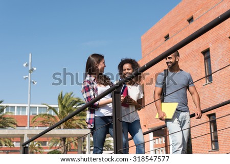 Group of students walking on school campus