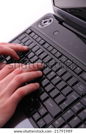 Male hands on laptop keyboard