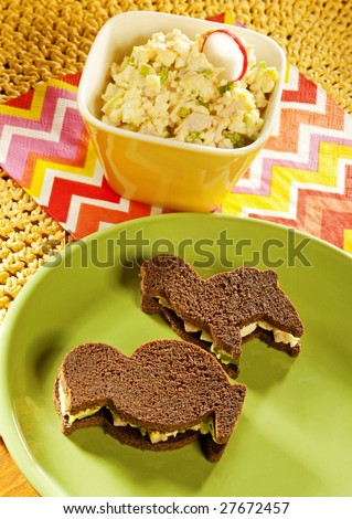 funny sandwiches for children with salad on background