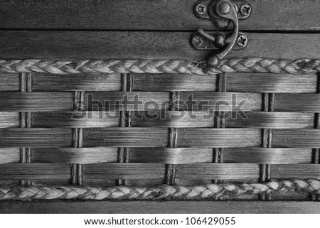 Closeup vintage wicker box with metal lock