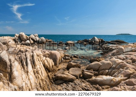 Natural stone arch and turquoise sea and blue sky, Ko Man Klang, Rayong, Thailand. Summer holiday maker or vacation in tropical country, Siam. beautiful seascape. Stock fotó © 