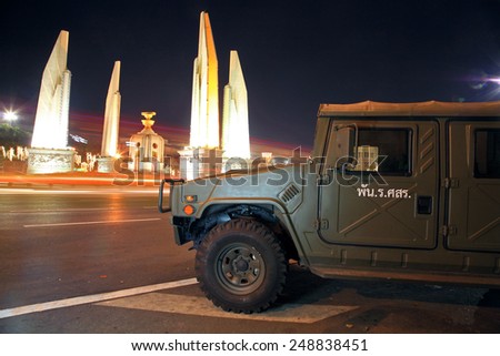 BANGKOK, THAILAND - DECEMBER 06, 2014: Military Truck parking near Democracy monument at night.Soldiers keep the peace around every important area in Bangkok, Thailand.