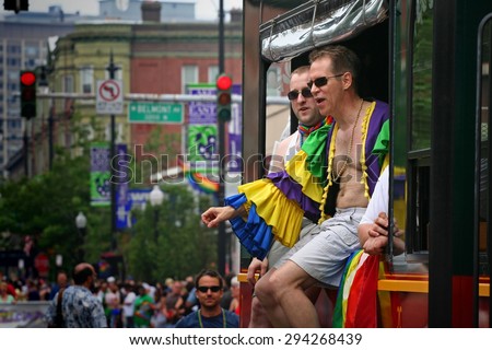 CHICAGO, IL, US - JUNE 25, 2007: Unidentified Gay men on vehicle to join Chicago Gay Pride Parade Celebration at Broadway street.
