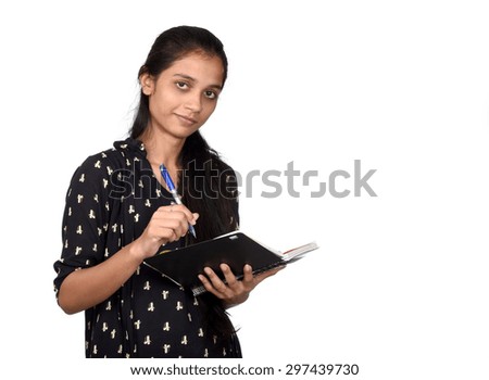 Pretty girl with pen and notebook on white background. writing plans for nearest future.