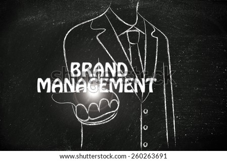 business man holding the word Brand Management
