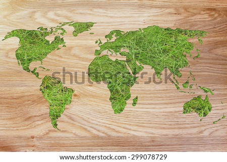 environmental awareness and green economy: illustration with map of the world made of green grass