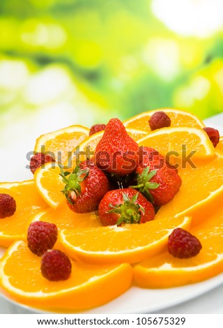 Orange, strawberry and raspberry, outdoors