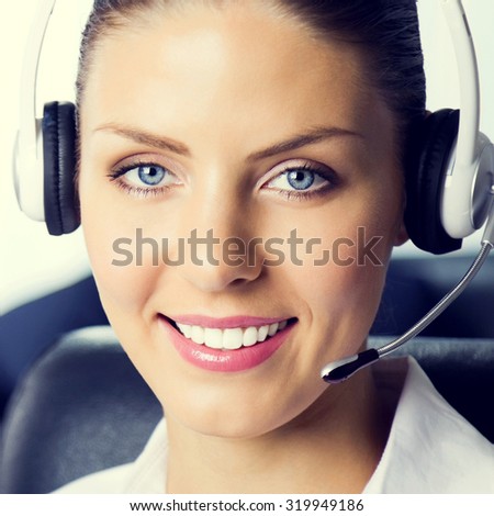 Portrait of smiling female support phone operator at workplace, customer service concept