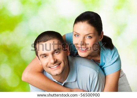 Young happy smiling attractive couple, outdoors