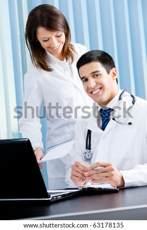 Two medical people working at office
