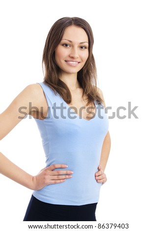 Portrait of beautiful young happy smiling woman in fitness wear, isolated over white background