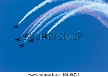 SONOMA, CA - JUN 24, 2012:  The nation\'s only civilian aerobatic jet team, The Patriots Jet Team, perform before the Toyota Save Mart 350 at the Raceway at Sonoma in Sonoma, CA on June 24, 2012.