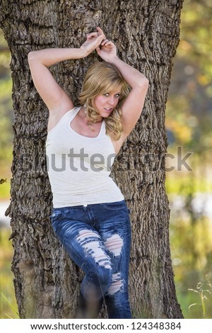 Beautiful blonde model posing in an outdoor environment