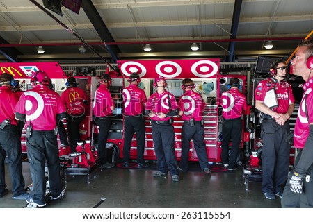 Fontana, CA - Mar 21, 2015:  The Target crew wait for their car to return during a practice session for the Auto Club 400 at Auto Club Speedway in Fontana, CA.